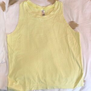 Bright yellow lightweight workout top. Breathable fabric.